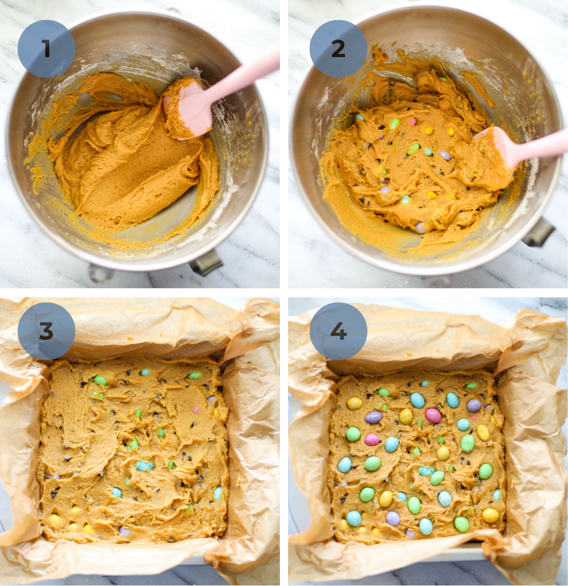 A stainless steel mixing bowl of wet blondie batter, mixed eggs, and placed into a parchment lined 8x8 baking pan with M&M eggs dotted on top.
