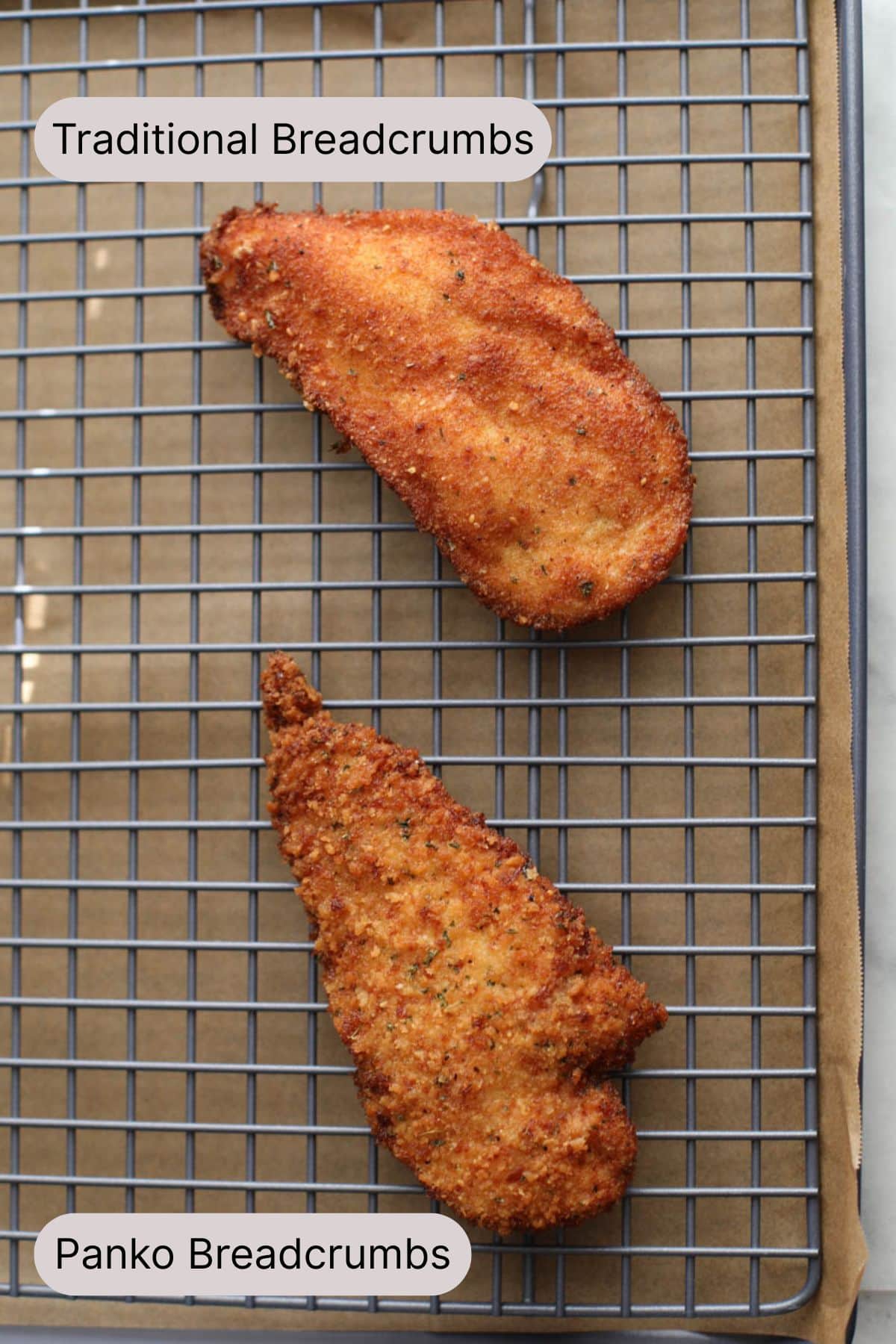 A side by side of a panko breadcrumb fried chicken cutlet and a traditional Italian breadcrumb fried chicken cutlet sitting on a blue wire rack.