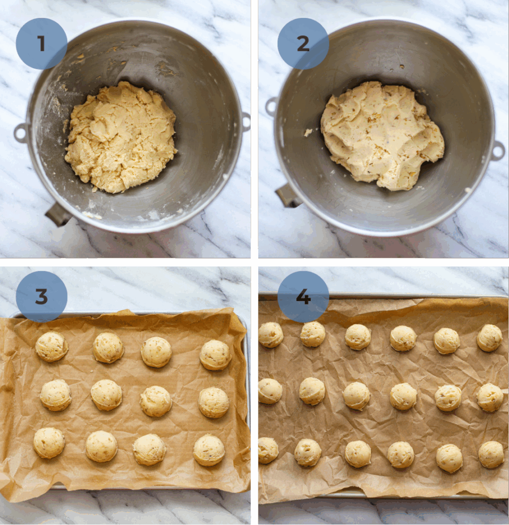 A stainless steel mixing bowl of snowball dough and then the dough with nuts added, and two cookie sheets with scooped dough balls, both small and large. 