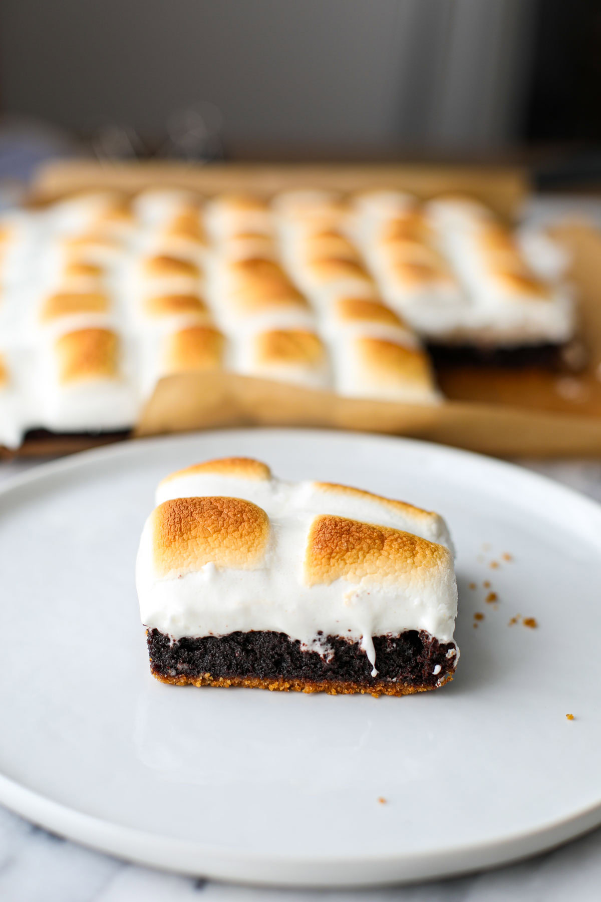 A smores brownies on a white plate.