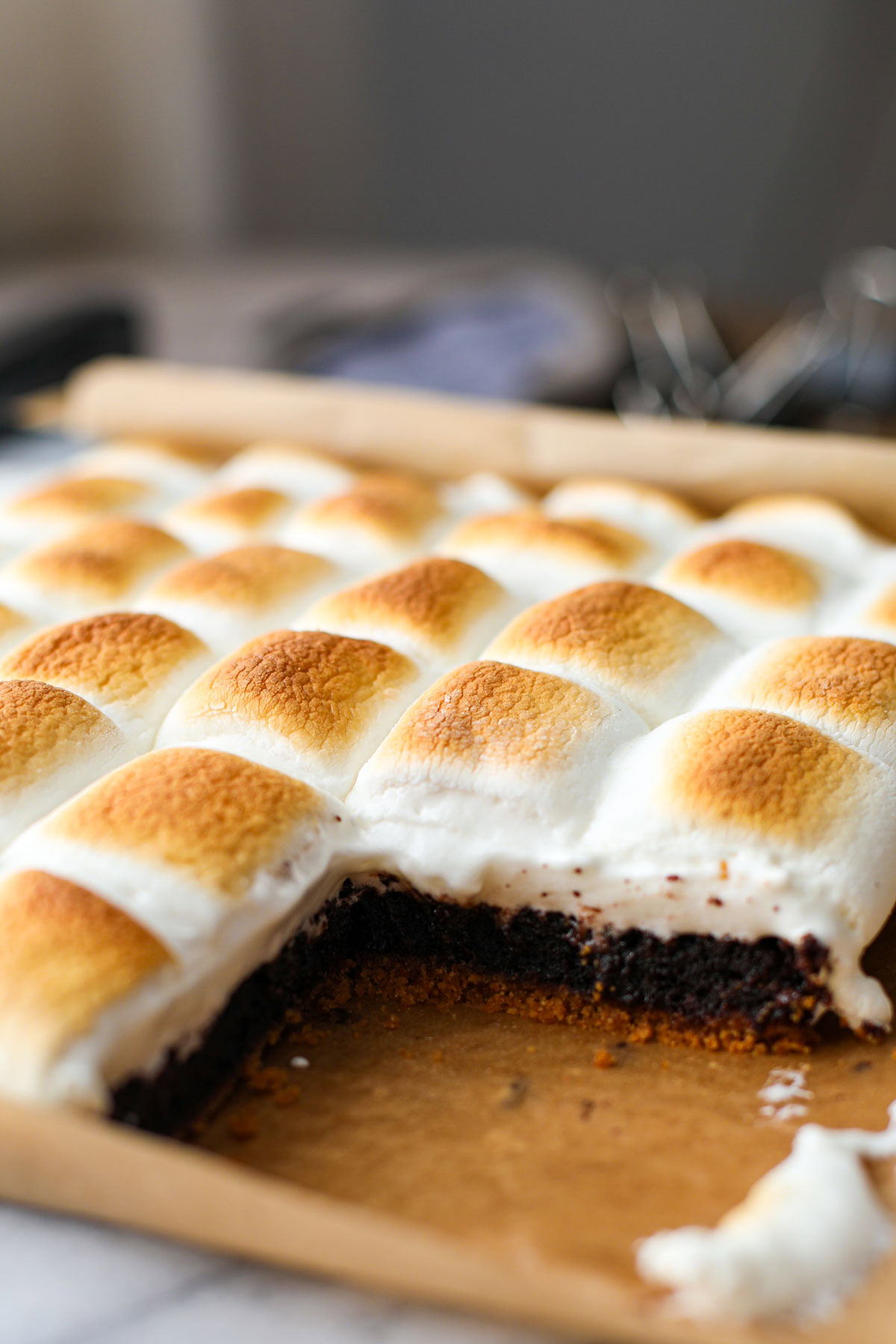 Smores brownies on parchment paper.