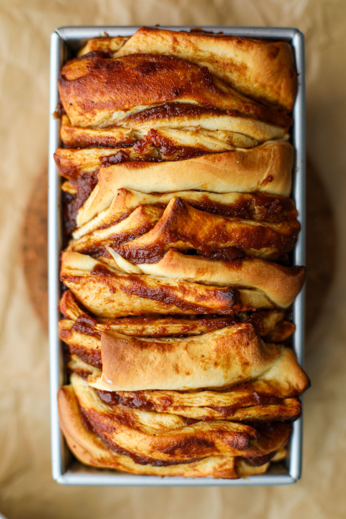 Apple butter pull apart loaf on parchment paper.