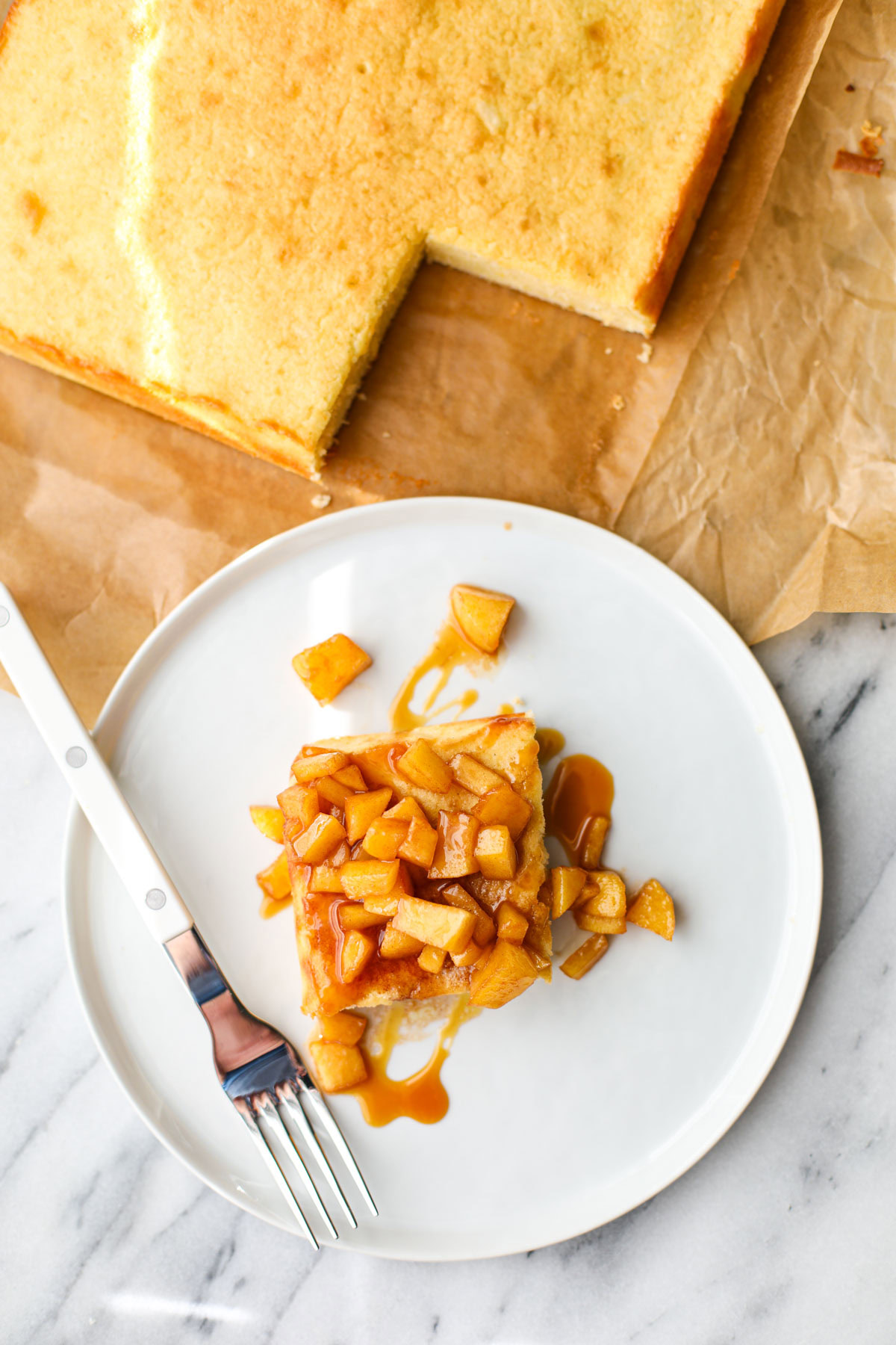 Caramel Apple Butter Cake on a white plate with a white fork.