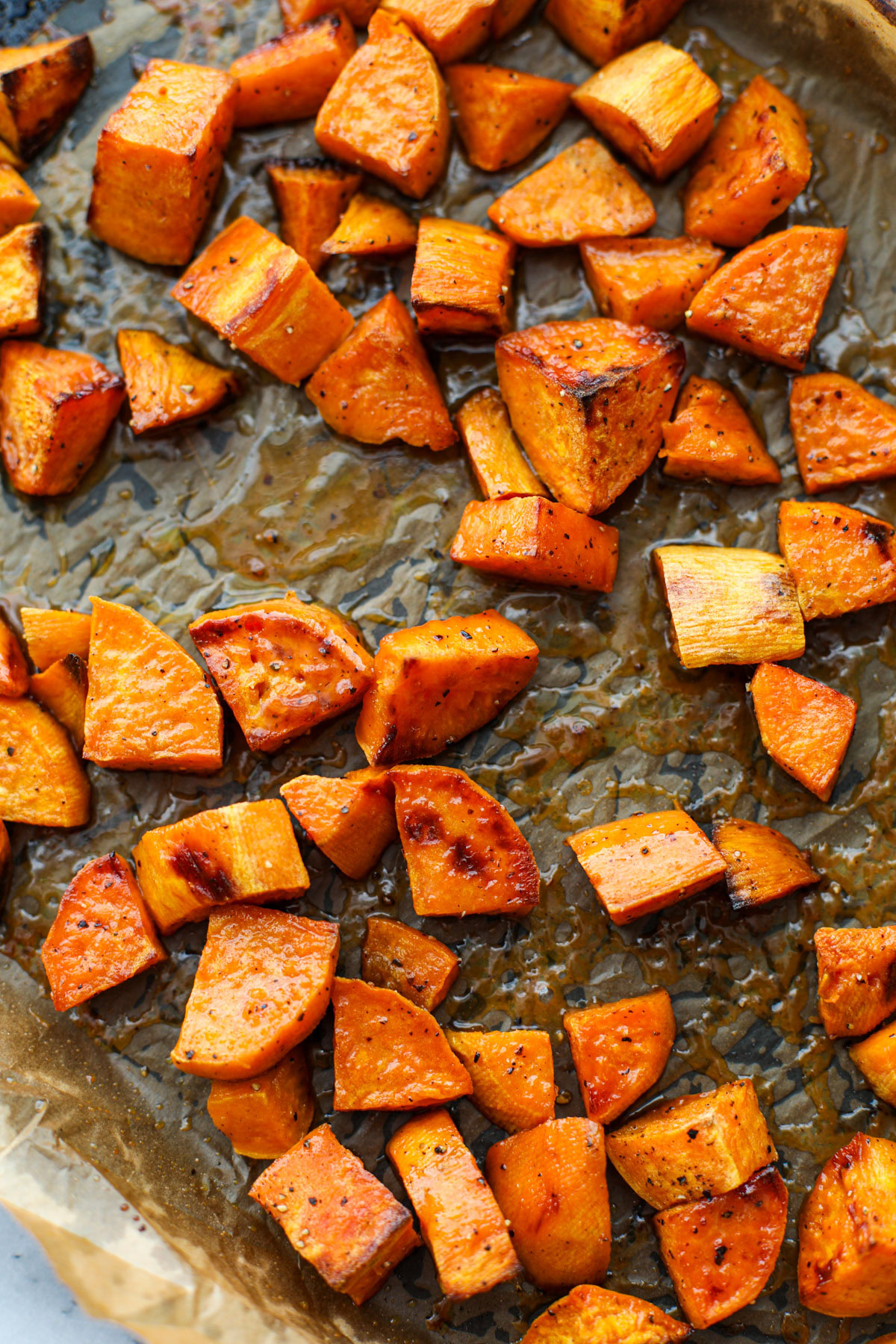 Maple Dijon Sweet Potatoes on a sheet tray.