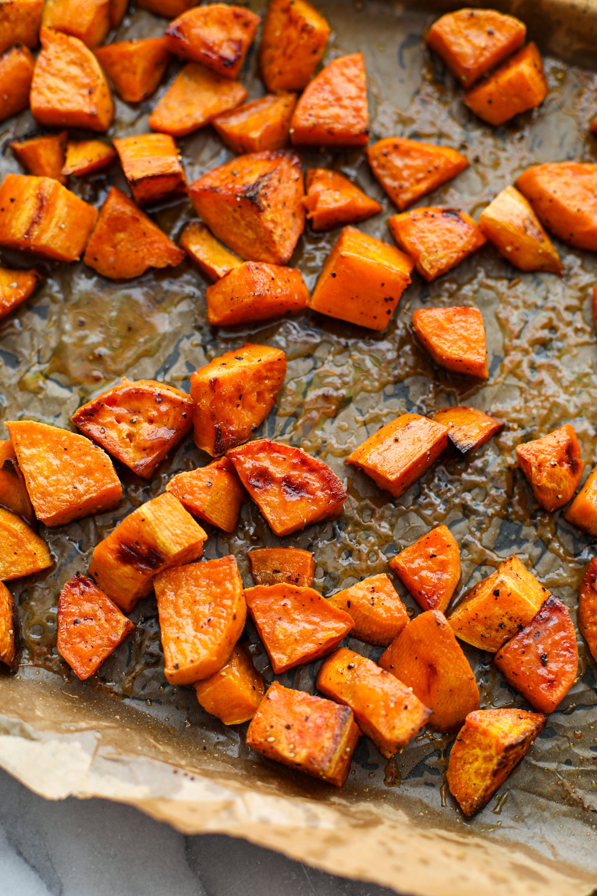 Maple Dijon Sweet Potatoes on a sheet tray.