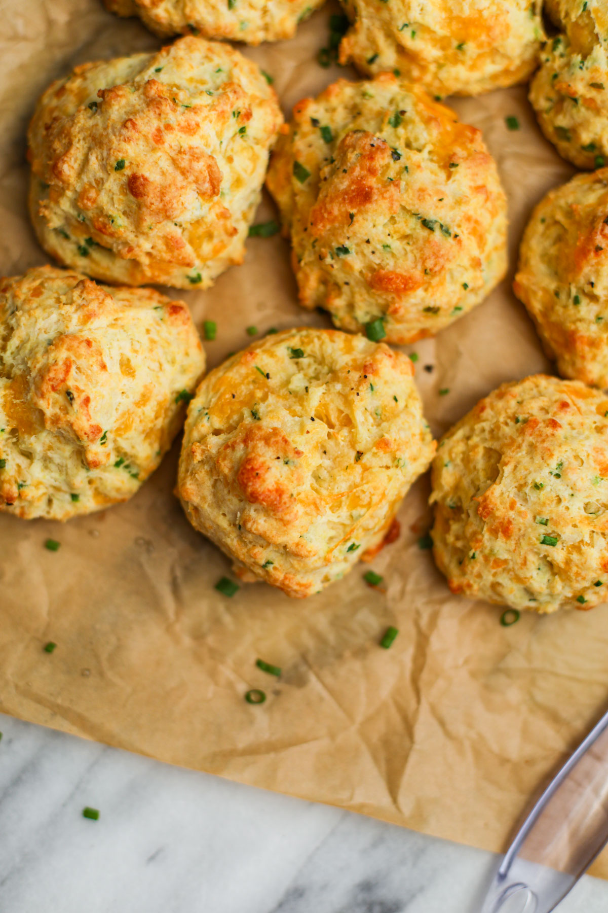 Cheddar chive biscuits brushed with garlic butter.